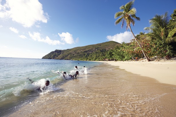 Fjian children playing in the surf (credit: Chris McLennan)